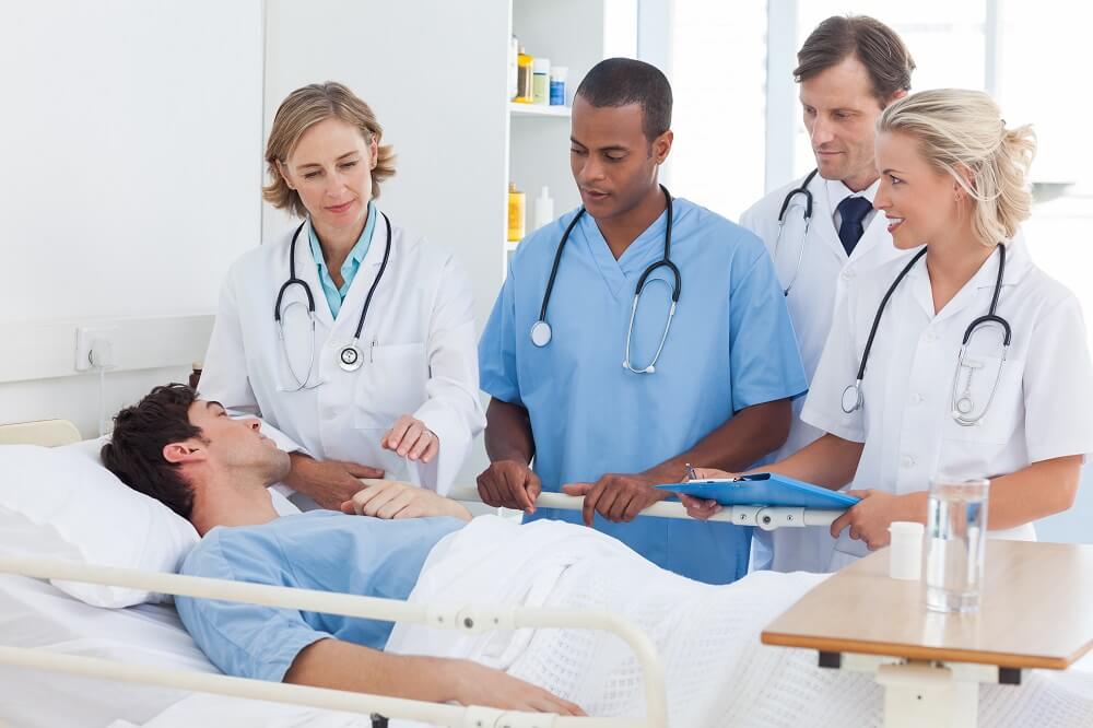 Doctors on meeting with the patient concerning his diagnosis.