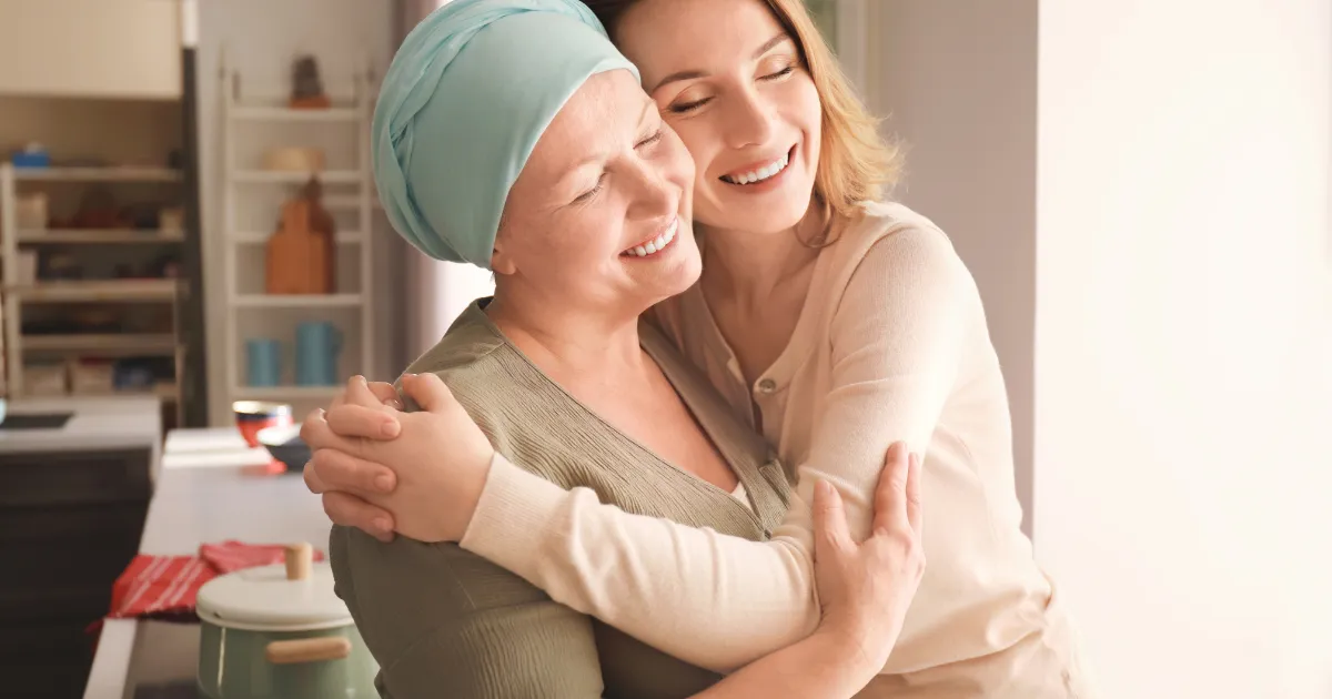 A daughter hugging her mother after she completed chemo therapy.