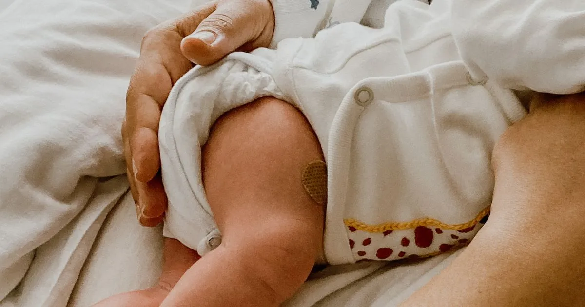 Mother holding her newly born baby.